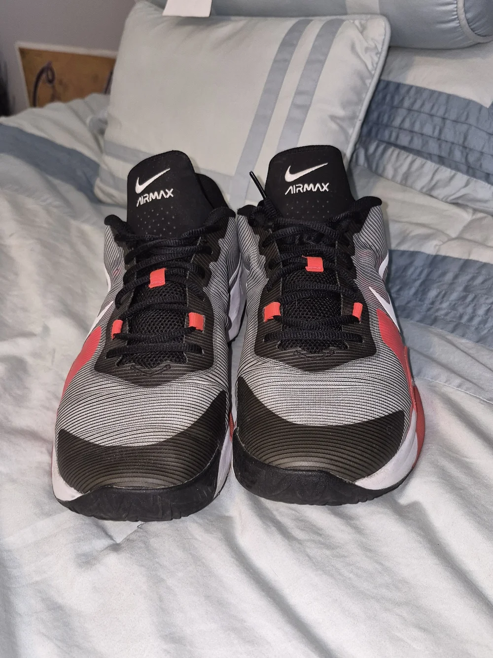 Nike Air Max Impact 4 'Black Bright Crimson' featuring a striped grey and bl